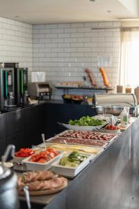 a buffet line with many different types of food at Efri-Vík Bungalows in Kirkjubæjarklaustur