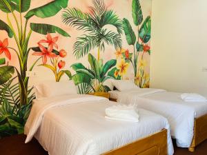 Katil atau katil-katil dalam bilik di Askari Inn Hotels