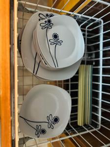three plates and bowls in a wire rack at El Patio de Polán in Polán +85 photos