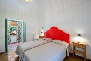 Ένα ή περισσότερα κρεβάτια σε δωμάτιο στο Casa Positamo