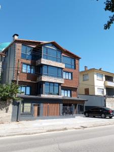 a building with a car parked in front of it at Daly Resort 2 in Sapanca
