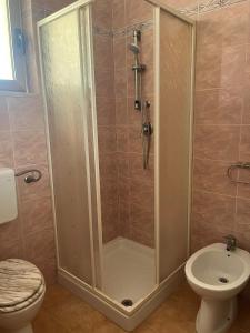 a bathroom with a shower and a toilet at La Casa Del Nonno in Ischitella +43 photos
