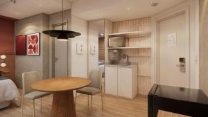 a room with a table and chairs and a kitchen at TW Cyclinn Vila Olimpia in São Paulo
