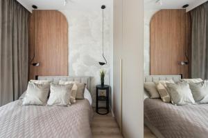 Postel nebo postele na pokoji v ubytování Noho Central Spodek, sauna, parking, siłownia