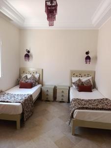 Postel nebo postele na pokoji v ubytování Residence CHAHD + 37 fotografií