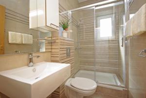 Et badeværelse på Apartments Herceg