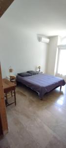 Postel nebo postele na pokoji v ubytování Bel appartement du centre ancien