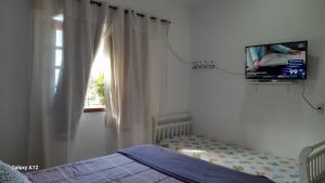 Postel nebo postele na pokoji v ubytování Hospedaria Casa de Maria