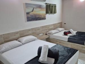 Postel nebo postele na pokoji v ubytování Hotel Brisas MEDELLIN + 33 fotografií
