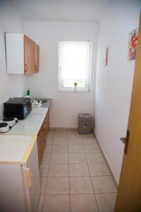 Kuchyň nebo kuchyňský kout v ubytování Guesthouse Bajric