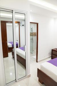 Postel nebo postele na pokoji v ubytování Cataleya Hotel
