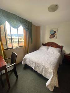 Postel nebo postele na pokoji v ubytování Hostal Pucará