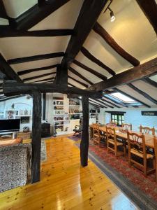 a dining room with wooden tables and chairs at Casa rural carrales in Matienzo