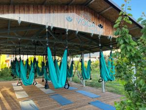 a group of blue umbrellas sitting under a roof at Hotel Plamena Palace in Primorsko +39 photos