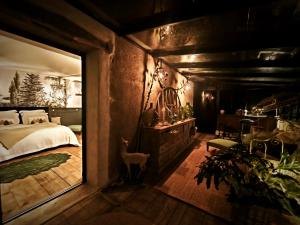 Katil atau katil-katil dalam bilik di chambre d'hôtes Madame
