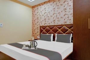 Кровать или кровати в номере Hotel O Blue Diamond