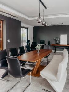 a dining room with a wooden table and chairs at Tropical Haven 4 Bedroom Pool Villa in Bang Tao Beach +102 photos