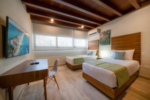 Postel nebo postele na pokoji v ubytování Luxury 2 Bedroom Condo - Infinity Pool at AWA Residences in Playacar, AWA 107 + 12 fotografií