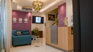 TV a/nebo společenská místnost v ubytování Cataleya Hotel