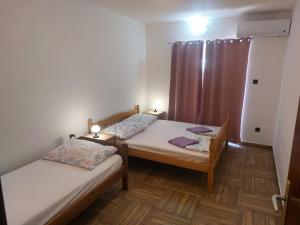 Postel nebo postele na pokoji v ubytování Croatia Apartman Masa