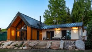 a house with a metal roof at Lipno - Luxury Lake Villa in Nové Domky