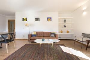 a living room with a couch and a table at LV Premier Marques MQ2 in Porto