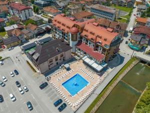 an aerial view of a house with a swimming pool at Apartman Suada in Fojnica