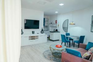 a living room with a couch and a table at Apartman Suada in Fojnica