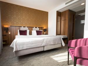 Postel nebo postele na pokoji v ubytování Best Western Hotel Mariacki Katowice