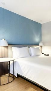 Hotel Habitel Select客房内的一张或多张床位