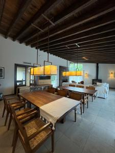 a large dining room with wooden tables and benches at Rocas del Plata in Potrerillos +35 photos
