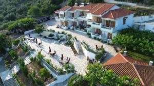 an aerial view of a house with a swimming pool at Armonia Elegant Apartments in Rovies