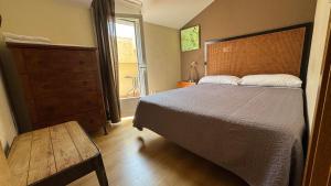 Postel nebo postele na pokoji v ubytování Apartamentos Alcazar de Baeza