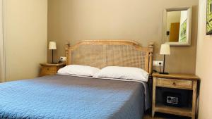 Postel nebo postele na pokoji v ubytování Apartamentos Alcazar de Baeza