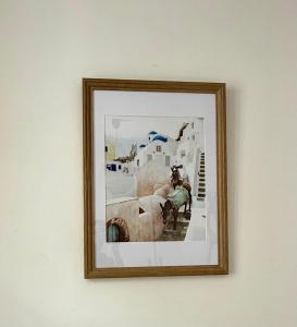 a picture hanging on a wall in a frame at Le Herriot 3 - Proche de la gare in Brive-la-Gaillarde