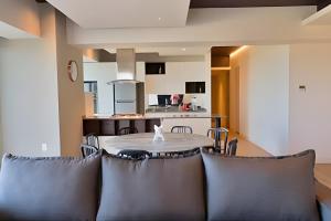 a dining room and kitchen with a table and chairs at Lobby 33 in Guadalajara