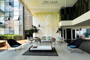 a lobby of a building with chairs and tables at Lobby 33 in Guadalajara
