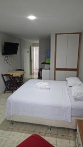 Katil atau katil-katil dalam bilik di Flat mobiliado em Intermares