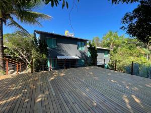 a large deck in front of a house at Pousada Cantim de BH in Venda Nova