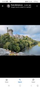 a screenshot of a picture of a river with a castle at The Garden Lodge in Cappoquin +9 photos