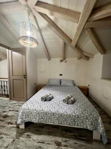 a bedroom with a bed with two pillows on it at Kassandra in Porto Heli
