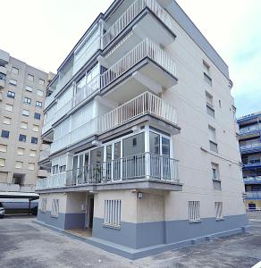 a building with balconies on the side of it at LA CURVA Orange Costa in Benicàssim