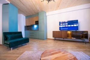 Televisyen dan/atau pusat hiburan di Go-Gudauri The Atrium Residence