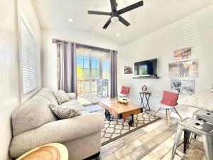 a living room with a couch and a table at Tiny Home #1 in Orderville