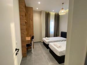 Postel nebo postele na pokoji v ubytování Apartamente Antoni Shengjin