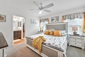 a bedroom with a bed and a ceiling fan at King Sized Comfort in The Village of Deluna in The Villages