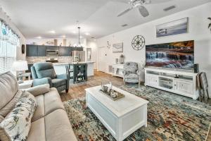 a living room with a couch and a table at King Sized Comfort in The Village of Deluna in The Villages