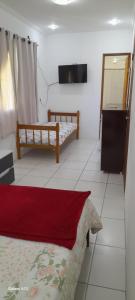 Postel nebo postele na pokoji v ubytování Hospedaria Casa de Maria
