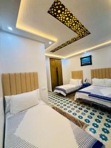 Letto o letti in una camera di Hôtel Koutoubia