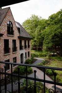 a view of a building from a balcony at Hotel Bent in Oisterwijk
